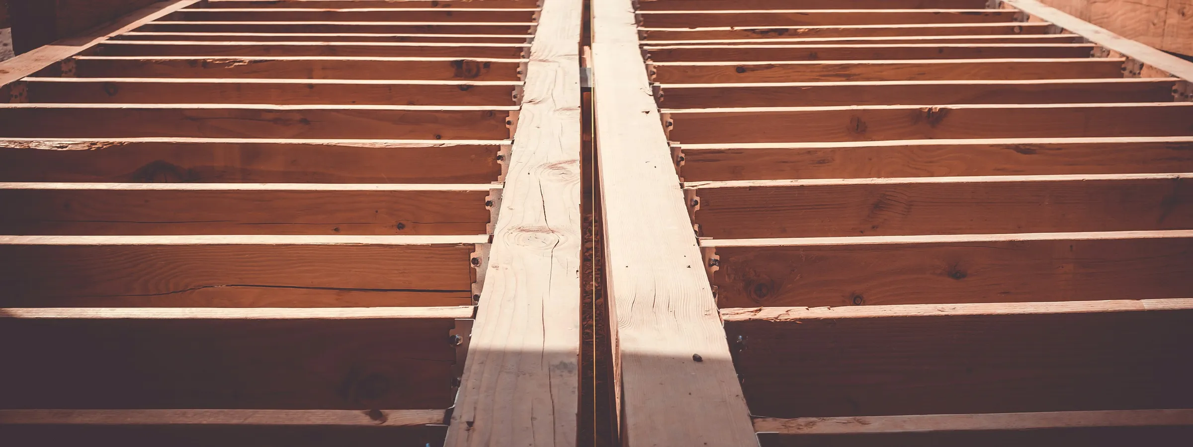 Raw timber floor joists on a construction site